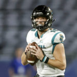 
              FILE - Coastal Carolina quarterback Grayson McCall (10) drops back to pass during the first half of an NCAA football game against Georgia State on Thursday, Sept. 22, 2022, in Atlanta. McCall will miss three to six weeks with a foot injury sustained a week ago in a win over Appalachian State. The school announced McCall's status Wednesday, Nov. 9. The injury's recovery timeline means that McCall's availability for a potential Sun Belt Conference championship game on Dec. 3 is in question. (AP Photo/Stew Milne, File)
            