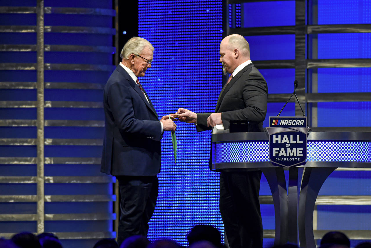 FILE - Coy Gibbs, right, presents the Hall of Fame ring to his father, NASCAR Hall of Fame inductee...