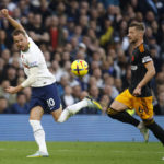 
              Tottenham's Harry Kane, left, duels for the ball with Leeds United's Liam Cooper during the English Premier League soccer match between Tottenham Hotspur and Leeds United at Tottenham Hotspur Stadium in London, Saturday, Nov. 12, 2022. (AP Photo/David Cliff)
            