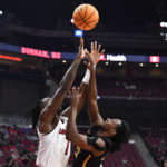 
              Appalachian State guard Terence Harcum (23) shoots over Louisville guard Mike James (1) during the first half of an NCAA college basketball game in Louisville, Ky., Tuesday, Nov. 15, 2022. (AP Photo/Timothy D. Easley)
            