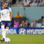 
              England's Harry Kane kicks the ball during the World Cup group B soccer match between England and Wales, at the Ahmad Bin Ali Stadium in Al Rayyan, Qatar, Tuesday, Nov. 29, 2022. (AP Photo/Thanassis Stavrakis)
            