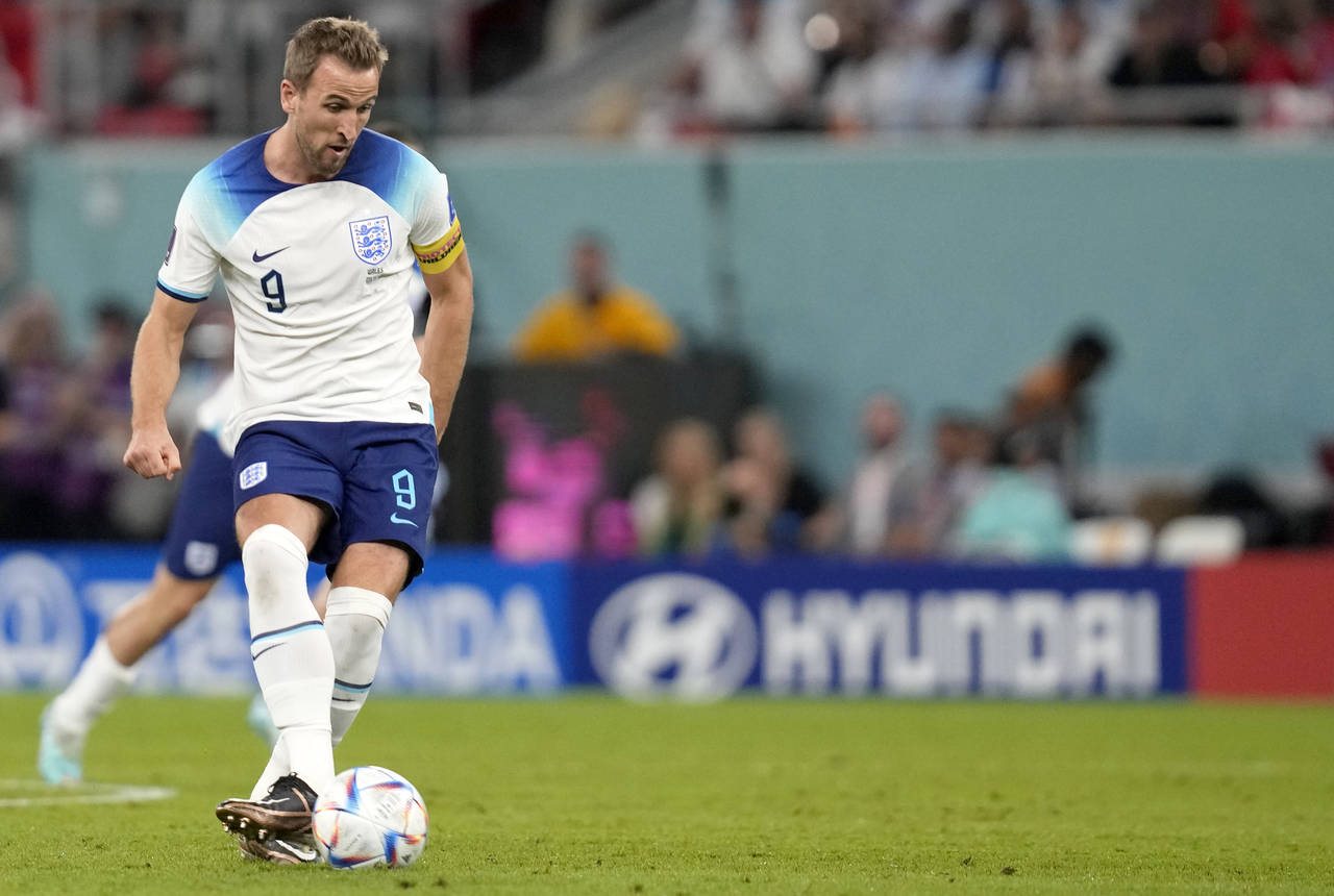 England's Harry Kane kicks the ball during the World Cup group B soccer match between England and W...