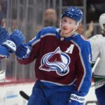 
              Colorado Avalanche defenseman Cale Makar (8) celebrates a goal against the Vancouver Canucks during the second period of an NHL hockey game Wednesday, Nov. 23, 2022, in Denver. (AP Photo/Jack Dempsey)
            