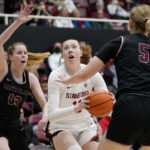 
              Stanford forward Ashten Prechtel, middle, drives to the basket against Santa Clara guard Lara Edmanson (13) and forward Olivia Pollerd (5) during the first half of an NCAA college basketball game in Stanford, Calif., Wednesday, Nov. 30, 2022. (AP Photo/Jeff Chiu)
            