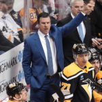 
              Pittsburgh Penguins head coach Mike Sullivan gives instructions from behind his bench during the first period of an NHL hockey game against the Carolina Hurricanes in Pittsburgh, Tuesday, Nov. 29, 2022. The Hurricanes won in overtime 3-2. (AP Photo/Gene J. Puskar)
            