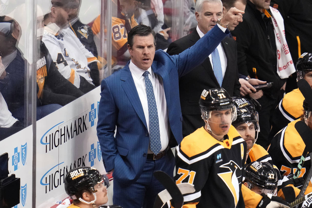 Pittsburgh Penguins head coach Mike Sullivan gives instructions from behind his bench during the fi...