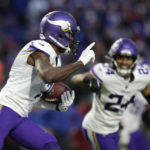 
              Minnesota Vikings cornerback Patrick Peterson (7) runs with the ball after incepting a pass by Buffalo Bills quarterback Josh Allen as safety Camryn Bynum (24) looks on in overtime of an NFL football game, Sunday, Nov. 13, 2022, in Orchard Park, N.Y. (AP Photo/Joshua Bessex)
            