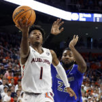 
              Auburn guard Wendell Green Jr. (1) shoots as Saint Louis forward Terrence Hargrove Jr. (22) defends during the second half of an NCAA college basketball game Sunday, Nov. 27, 2022, in Auburn, Ala. (AP Photo/Butch Dill)
            