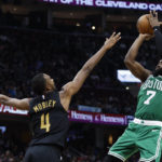 
              Boston Celtics guard Jaylen Brown (7) shoots against Cleveland Cavaliers forward Evan Mobley (4) during the second half of an NBA basketball game Wednesday, Nov. 2, 2022, in Cleveland. The Cavaliers won 114-113 in overtime. (AP Photo/Ron Schwane)
            