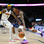 
              Houston Rockets guard Kevin Porter Jr. (3) drives to the basket against Denver Nuggets guard Kentavious Caldwell-Pope (5) during the second quarter of an NBA basketball game, Wednesday, Nov. 30, 2022, in Denver. (AP Photo/Jack Dempsey)
            