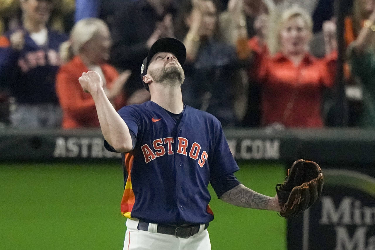 Houston Astros relief pitcher Ryan Pressly celebrates their win in Game 2 of baseball's World Serie...