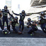 
              Seattle Seahawks safety Quandre Diggs (6) celebrates with teammates after intercepting a pass during the first half of an NFL football game against the Las Vegas Raiders Sunday, Nov. 27, 2022, in Seattle. (AP Photo/Caean Couto)
            