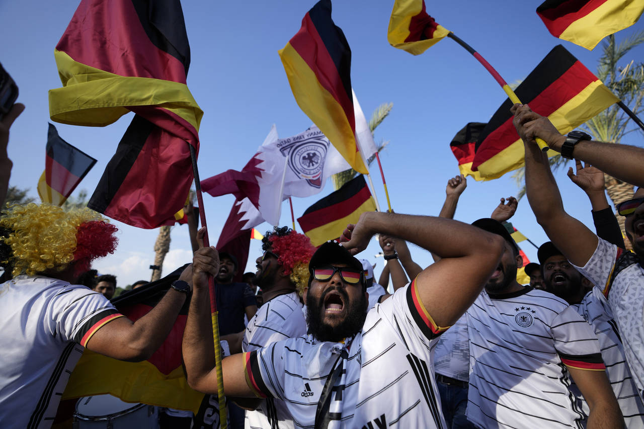 German fans cheer at flag plaza in Doha, Qatar, Friday, Nov. 11, 2022. Final preparations are being...