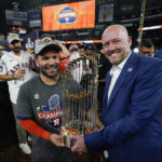 
              Houston Astros second baseman Jose Altuve and general manager James click celebrate with the trophy after their 4-1 World Series win against the Philadelphia Phillies in Game 6 on Saturday, Nov. 5, 2022, in Houston. (AP Photo/David J. Phillip)
            