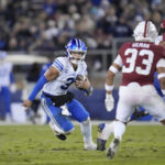 
              BYU quarterback Jaren Hall (3) runs the ball against Stanford during the second half of an NCAA college football game in Stanford, Calif., Saturday, Nov. 26, 2022. (AP Photo/Godofredo A. Vásquez)
            