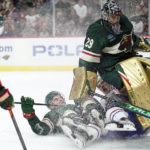 
              Minnesota Wild center Steven Fogarty (28), middle left, and Montreal Canadiens left wing Juraj Slafkovsky (20), middle right, collide into Minnesota Wild goaltender Marc-Andre Fleury (29), right, during the second period of an NHL hockey game Tuesday, Nov. 1, 2022, in St. Paul, Minn. (AP Photo/Abbie Parr)
            