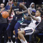 
              UNC Wilmington forward Amari Kelly, left, fouls Connecticut's Jordan Hawkins during the first half of an NCAA college basketball game Friday, Nov. 18, 2022, in Storrs, Conn. (AP Photo/Jessica Hill)
            