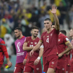 
              Serbia's soccer players react after losing 2-0 at the end of the World Cup group G soccer match between Brazil and Serbia, at the Lusail Stadium in Lusail, Qatar, Thursday, Nov. 24, 2022. (AP Photo/Natacha Pisarenko)
            