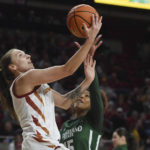 
              Iowa State guard Emily Ryan, left, goes to the basket against Cleveland State forward Brittni Moore (15) during the first half of an NCAA women's college basketball game at Jack Trice Stadium in Ames, Iowa, Monday, Nov. 7, 2022. (Nirmalendu Majumdar/Ames Tribune via AP)
            