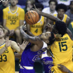 
              McNeese State forward Christian Shumate (24) battles Baylor forward Josh Ojianwuna (15) and Caleb Lohner (33) for control of the ball in the second half of an NCAA college basketball game, Wednesday, Nov. 23, 2022, in Waco, Texas. (AP Photo/Rod Aydelotte)
            