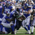 
              New York Giants linebacker Jihad Ward (55) tackles Houston Texans running back Dameon Pierce (31) during the first quarter of an NFL football game, Sunday, Nov. 13, 2022, in East Rutherford, N.J. (AP Photo/John Minchillo)
            