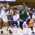 
              Jacksonville's Kevion Nolan (3) handles the ball as Duke's Jaylen Blakes (2) defends during the first half of an NCAA college basketball game in Durham, N.C., Monday, Nov. 7, 2022. (AP Photo/Ben McKeown)
            