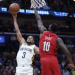 
              New Orleans Pelicans guard CJ McCollum (3) goes to the basket against Portland Trail Blazers forward Nassir Little (10) during the first half of an NBA basketball game in New Orleans, Thursday, Nov. 10, 2022. (AP Photo/Gerald Herbert)
            