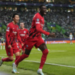 
              Frankfurt's Randal Kolo Muani, right, celebrates with Daichi Kamada, left, after scoring his side's second goal during a Champions League group D soccer match between Sporting CP and Frankfurt at the Alvalade stadium in Lisbon, Tuesday, Nov. 1, 2022. (AP Photo/Armando Franca)
            