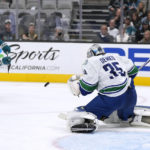 
              Vancouver Canucks goaltender Thatcher Demko (35) blocks a shot by San Jose Sharks right wing Kevin Labanc (62) during the second period of an NHL hockey game, Sunday, Nov. 27, 2022, in San Jose, Calif. (AP Photo/Tony Avelar)
            