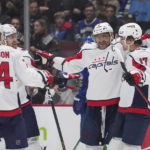 
              Washington Capitals' Alex Ovechkin (8), Dylan Strome (17), Anthony Mantha (39) and John Carlson (74) celebrate Ovechkin's second goal against the Vancouver Canucks during the first period of an NHL hockey game Tuesday, Nov. 29, 2022, in Vancouver, British Columbia. (Darryl Dyck/The Canadian Press via AP)
            