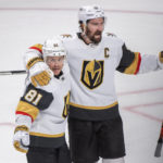 
              Vegas Golden Knights' Jonathan Marchessault (81) celebrates with Mark Stone after scoring against the Montreal Canadiens during the third period of an NHL hockey game Saturday, Nov. 5, 2022, in Montreal. (Graham Hughes/The Canadian Press via AP)
            