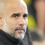 
              Manchester City's head coach Pep Guardiola gestures prior to the Champions League Group G soccer match between Borussia Dortmund and Manchester City in Dortmund, Germany, Tuesday, Oct. 25, 2022. (AP Photo/Martin Meissner)
            