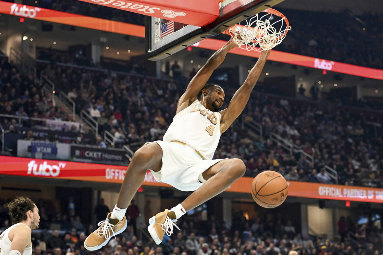 Cleveland Cavaliers forward Evan Mobley dunks during the first half of an NBA basketball game again...
