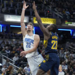 
              Orlando Magic forward Franz Wagner (22) shoots over Indiana Pacers forward Aaron Nesmith (23) during the first half of an NBA basketball game in Indianapolis, Saturday, Nov. 19, 2022. (AP Photo/AJ Mast)
            