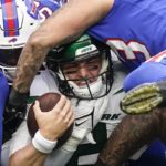 
              New York Jets quarterback Zach Wilson , center, is stopped by Buffalo Bills' Terrel Bernard (43) during the first half of an NFL football game, Sunday, Nov. 6, 2022, in East Rutherford, N.J. (AP Photo/John Minchillo)
            