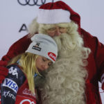 
              United States' Mikaela Shiffrin embraces Santa Claus after winning an alpine ski, women's World Cup slalom, in Levi, Finland, Sunday, Nov. 20, 2022. (AP Photo/Alessandro Trovati)
            