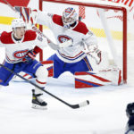 
              Montreal Canadiens' Jordan Harris (54) deflects a shot by Winnipeg Jets' Nate Schmidt (88) toward goaltender Sam Montembeault (35) during second-period NHL hockey game action in Winnipeg, Manitoba, Thursday, Nov. 3, 2022. (John Woods/The Canadian Press via AP)
            