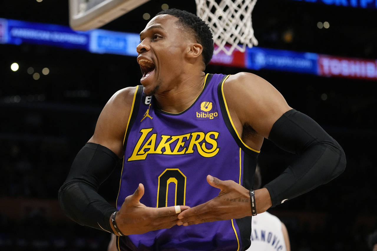Los Angeles Lakers guard Russell Westbrook celebrates after scoring during the first half of an NBA...