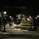 
              A bus idles behind police tape during an active shooter situation at the University of Virginia in Charlottesville, Va., on Monday, Nov. 14, 2022. A few people have been killed and a few others were wounded in a shooting late Sunday at the University of Virginia, according to the school’s president. Police are searching for a suspect, who remains at large. (Mike Kropf /The Daily Progress via AP)
            