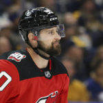 
              New Jersey Devils left wing Tomas Tatar (90) smiles after scoring a goal during the second period of an NHL hockey game against the Buffalo Sabres on Friday, Nov. 25, 2022, in Buffalo, N.Y. (AP Photo/Joshua Bessex)
            