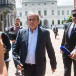 
              FILE -  The former president of the the European Football Association (UEFA) Michel Platini, center, is leaving the Swiss Federal Criminal Court in Bellinzona, Switzerland, after the first day of his trial, Wednesday, June 8, 2022. Picking Qatar to host the World Cup was a mistake 12 years ago, FIFA’s president at the time Sepp Blatter said Tuesday, Nov. 8, 2022, again citing a meeting between Nicolas Sarkozy and Michel Platini for swaying key votes. (Ti-Press/Alessandro Crinari/Keystone via AP, File)
            