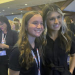 
              NASCAR driver Hailie Deegan, right, poses with 15-year-old Katie Hettinger, a Michigan racer who had just been announced as a participant in the Drive for Diversity combine, at the Women in Motorsports convention at Charlotte Motor Speedway in Concord, N.C., on Oct. 6, 2022. (AP Photo/Jenna Fryer)
            