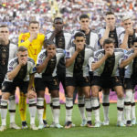 
              Players from Germany pose for the team photo as they cover their mouth during the World Cup group E soccer match between Germany and Japan, at the Khalifa International Stadium in Doha, Qatar, Wednesday, Nov. 23, 2022. (AP Photo/Ebrahim Noroozi)
            