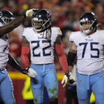 
              Tennessee Titans running back Derrick Henry (22) is congratulated by teammates after scoring during the first half of an NFL football game against the Kansas City Chiefs Sunday, Nov. 6, 2022, in Kansas City, Mo. (AP Photo/Charlie Riedel)
            