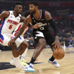 
              Los Angeles Clippers guard Paul George, right, is defended by Detroit Pistons guard Hamidou Diallo, left, during the first half of an NBA game basketball game Thursday, Nov. 17, 2022, in Los Angeles. (AP Photo/Raul Romero Jr.)
            