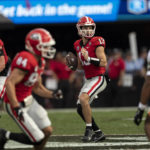 
              Georgia quarterback Stetson Bennett (13) throws from the pocket during the first half of an NCAA college football game against Tennessee, Saturday, Nov. 5, 2022 in Athens, Ga. (AP Photo/John Bazemore)
            