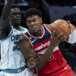 
              Washington Wizards forward Rui Hachimura drives to the basket while guarded by Charlotte Hornets forward JT Thor in the second half of an NBA preseason basketball game in Charlotte, N.C., Monday, Oct. 10, 2022. (AP Photo/Jacob Kupferman)
            