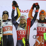 
              From left, second placed Sweden's Anna Swenn Larsson, the winner United States' Mikaela Shiffrin and third placed Slovakia's Petra Vlhova celebrate after an alpine ski, women's World Cup slalom, in Levi, Finland, Saturday, Nov. 19, 2022. (AP Photo/Alessandro Trovati)
            