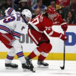 
              New York Rangers center Mika Zibanejad (93) steals the puck from Detroit Red Wings center Oskar Sundqvist (70) during the second period of an NHL hockey game Thursday, Nov. 10, 2022, in Detroit. (AP Photo/Duane Burleson)
            