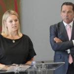 
              FILE- Dr. Hillary Cauthen, left, a former consulting psychologist for the San Antonio Spurs, speaks alongside her attorney Tony Buzbee during a press conference, on Thursday, Nov. 3, 2022, in Houston. Cauthen has settled her lawsuit against the team and former player Josh Primo over allegations he had exposed himself to her multiple times in private sessions, her attorney said Thursday, Nov. 17, 2022. (Melissa Phillip/Houston Chronicle via AP, File)
            